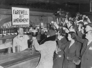 People celebrating the end of prohibition in a bar
